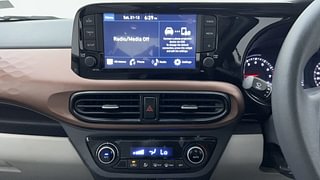 Used 2023 Hyundai Aura SX Plus 1.2 AMT Petrol Petrol Automatic interior MUSIC SYSTEM & AC CONTROL VIEW