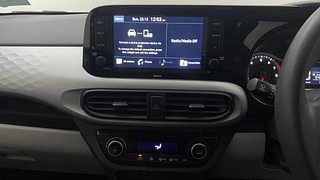 Used 2021 Hyundai Grand i10 Nios Sportz 1.2 Kappa VTVT Petrol Manual top_features Integrated (in-dash) music system