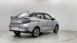 Used 2023 Hyundai Aura SX 1.2 CNG Petrol+cng Manual exterior RIGHT REAR CORNER VIEW