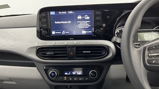 Used 2021 Hyundai Grand i10 Nios Sportz 1.2 Kappa VTVT Petrol Manual top_features Integrated (in-dash) music system