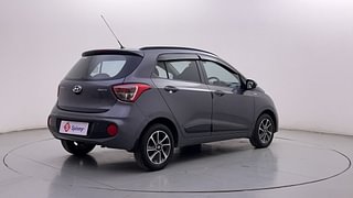 Used 2018 Hyundai Grand i10 [2017-2020] Sportz (O) AT 1.2 Kappa VTVT Petrol Automatic exterior RIGHT REAR CORNER VIEW