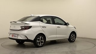 Used 2023 Hyundai Aura SX 1.2 CNG Petrol+cng Manual exterior RIGHT REAR CORNER VIEW