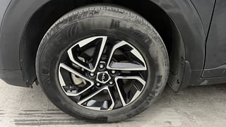 Used 2022 Kia Carens Prestige Plus 1.4 Petrol 7 STR Petrol Manual tyres LEFT FRONT TYRE RIM VIEW