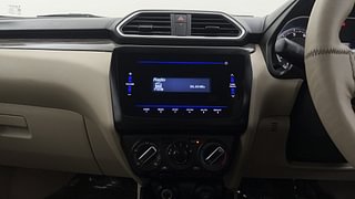 Used 2022 Maruti Suzuki Dzire VXI Petrol Manual top_features Integrated (in-dash) music system