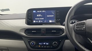 Used 2022 Hyundai Grand i10 Nios Asta AMT 1.2 Kappa VTVT Petrol Automatic top_features Integrated (in-dash) music system