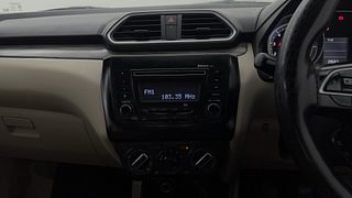 Used 2021 Maruti Suzuki Dzire VXI Petrol Manual top_features Integrated (in-dash) music system