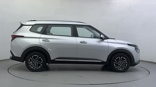 Used 2022 Kia Carens Luxury Plus 1.4 Petrol 7 STR Petrol Manual exterior RIGHT SIDE VIEW