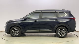 Used 2023 Kia Carens Luxury Plus 1.5 Turbo Petrol iMT 7 STR Petrol Manual exterior LEFT SIDE VIEW