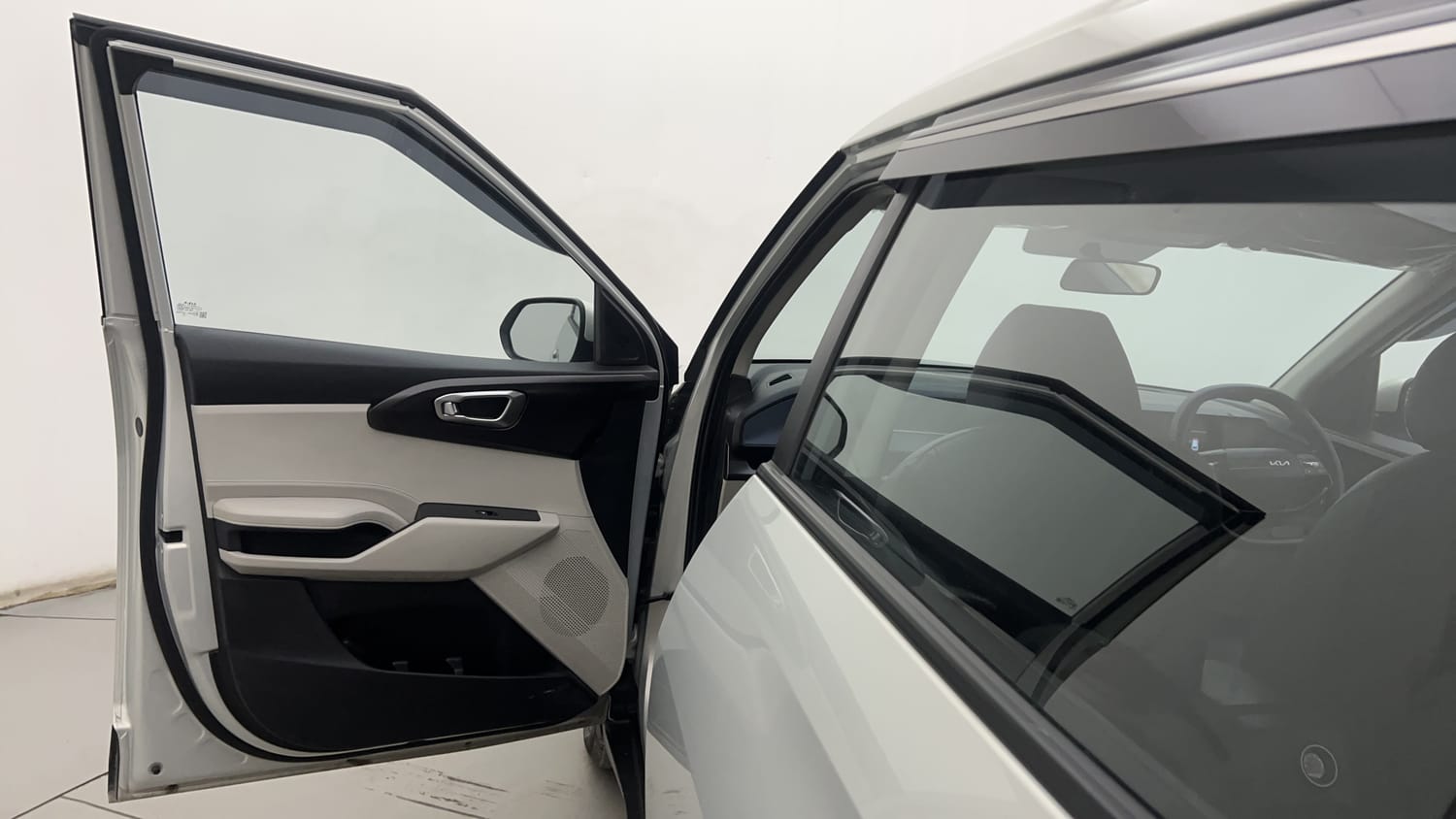 New Kia Carens Clavis interior LEFT FRONT DOOR OPEN VIEW