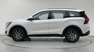 Used 2024 Mahindra XUV700 AX 7 Petrol AT 7 STR Petrol Automatic exterior LEFT SIDE VIEW